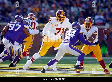 Washington Redskins tackle Trent Williams (71) and Green Bay Packers  defensive end Mike Daniels (76) scuffle after a Washington turnover during  the first half of their NFC Wild Card game at FedEx