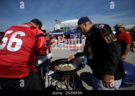 Fans tailgate prior to an NFL football game between the Houston