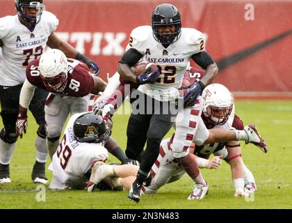 East Carolina running back Chris Hairston (22) rushes for yardage past  Florida linebacker Jarrad Davis (40) and Justus Reed (97) during the first  half of an NCAA college football game in Gainesville