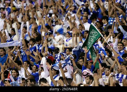 Saudi Arabia's Al Hilal soccer team players celebrate their trophy of the  AFC Champions League 2021 after the team beats South Korea's Pohang  Steelers 2-0 during their final soccermatch at the King