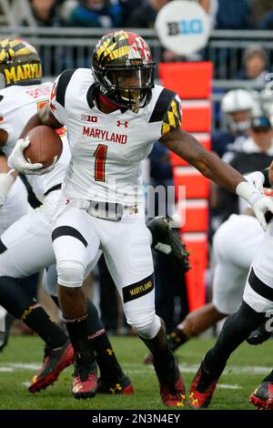 University of Maryland Terrapins receiver Stefon Diggs (1) tries to avoid  University of Iowa Hawkeyes defensive back John Lowdermilk (37) during game  played at Capital One Field at Byrd Stadium in College