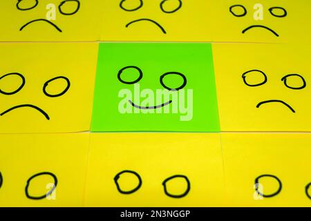 conceptual image for a be different or be happy concept using sticky notes Stock Photo