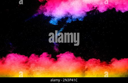 Explosion of colored powder isolated on black background. Abstract colored background Stock Photo