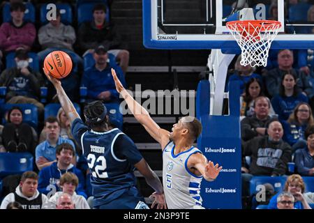 St. Louis, MO, USA, FEBRUARY 07, 2023: Rhode Island Rams forward Alex Tchikou (22) lays up a shot over the blocking attempt of Saint Louis Billikens forward Francis Okoro (5) in a conference game where the Rhode Island Rams visited the St. Louis Billikens. Held at Chaifetz Arena in St. Louis, MO on February 07, 2023 Richard Ulreich/CSM Stock Photo