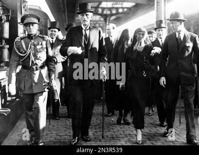 The parents of Queen Astrid of Belgium - Prince Charles and Princess Ingeborg of Sweden, center, followed by her sister Princess Martha and her husband Crown Prince Olaf of Norway and Prince Axel of Denmark, right, who met them on arrival at the station in Brussels, Belgium on September 1, 1935, for the funeral of Queen Astrid. (AP Photo)