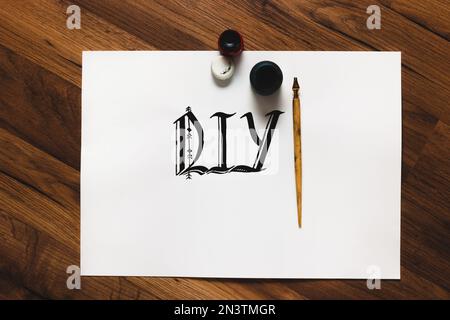 Calligraphy word and tools Stock Photo