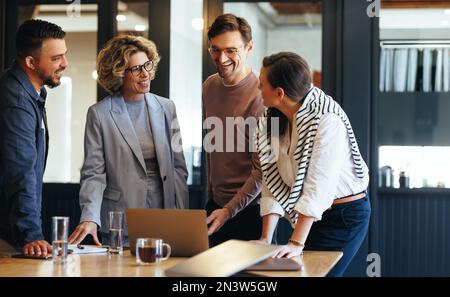 Group of business people having a meeting in a tech company. Creative business professionals planning a project in an office. Teamwork and collaborati Stock Photo