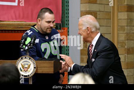 Student James Cantway wears a Seattle Seahawks' Marshawn Lynch football  jersey as he introduces Vice President Joe Biden at Renton Technical  College in Renton, Wash.,Thursday, Oct. 9, 2014. Biden discussed workplace  and