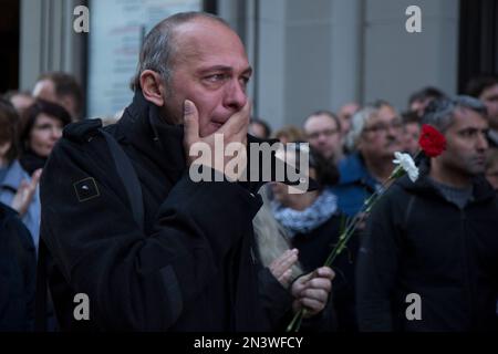 People pay their respects outside the Alexander McQueen New