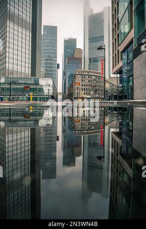 Skyscraper canyon in Frankfurt am Main with view into Neue Mainzer Strasse, reflection with the skyscrapers Commerzbank Tower, Eurotower, K26 Stock Photo
