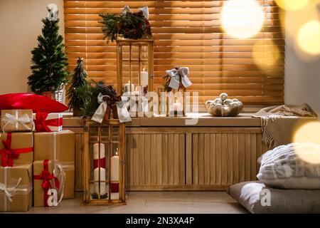 Beautiful wooden Christmas lanterns in decorated room Stock Photo
