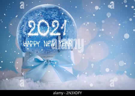 Snow globe with numbers, space for text. 2021 New Year greeting card design. Stock Photo