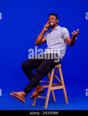 Portrait of handsome excited cheerful joyful delightful curious guy wearing casual sending Stock Photo