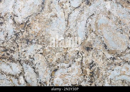 Variegated wall surface in beige, brown and gray-blue tones with black striped patches. Stock Photo