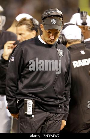 Oakland Raiders' head coach Dennis Allen looks at the replay screen in  their game against the Seattle Seahawks at CenturyLink Field in Seattle,  Washington on August 30, 2012. The Seahawks beat the