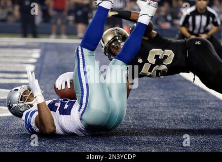 Dallas Cowboys' DeMarco Murray (29) falls into the end zone for a touchdown  in front of New Orleans Saints inside linebacker Ramon Humber (53) during  the second half of an NFL football