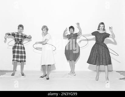 In the 1950s. Women Hula hooping. A craze that culminated during 1958 with some 20 million hula hoop rings sold in less than four months in the USA. Sweden 1958 ref BV18-4 Stock Photo