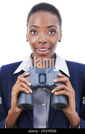 Looking for new business horizons. a young african american businesswoman holding binoculars. Stock Photo