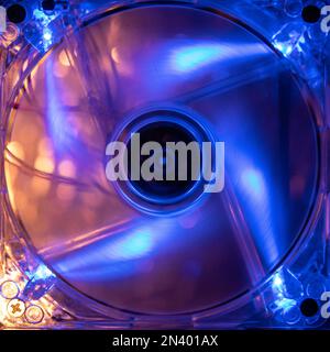 Close up of spinning computer fans installed or close up of DVD's / CD's Stock Photo