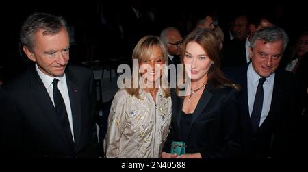 LVMH CEO Bernard Arnault and his wife Helene attend the British designer  John Galliano's Haute-Couture Spring-Summer 2006 fashion show for the  French house Dior at the Polo Club in Paris, France, on