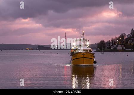 Crosshaven, Cork, Ireland. 08th February, 2023. Fishing boat Celtic Sun motors through the harbour at dawn,  as she makes her way to the pier to unload her catch of Hake at Crosshaven, Co. Cork, Ireland. - Credit; David Creedon / Alamy Live News Stock Photo