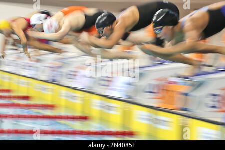 Swimmers dive in to start the Women's 4x200 Freestyle Relay