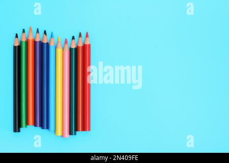 Colored pencils. A set colored pencils isolated on a blue background. Copy space. Stock Photo