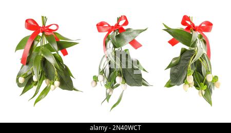mistletoe's bunch with red ribbon on white background Stock Photo - Alamy