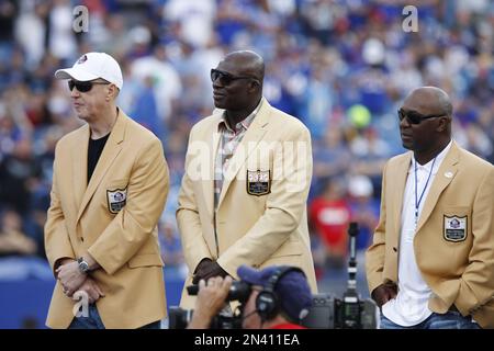 Former Buffalo Bills' Thurman, left, is presented his bust by Marv