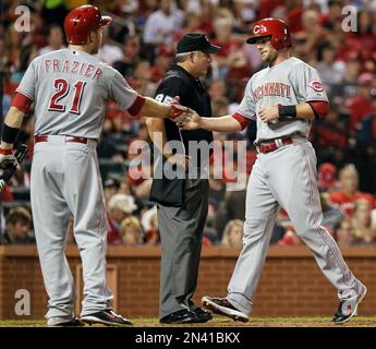 Cincinnati Reds' Todd Frazier, left, is congratulated by teammate Brandon  Phillips after hitting a solo home run during the sixth inning of a baseball  game against the St. Louis Cardinals, Friday, Sept.