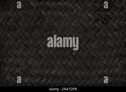 Black woven bamboo mat texture. Horizontal background wallpaper Stock Photo