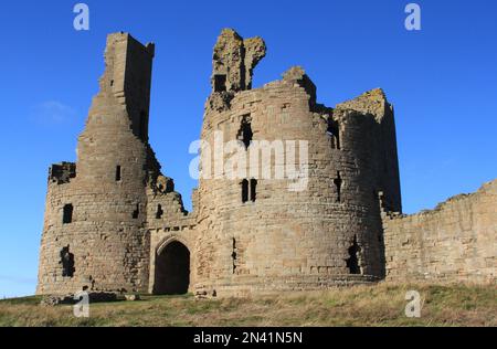 The ruin of Dunstanburgh Castle in Northumberland Stock Photo
