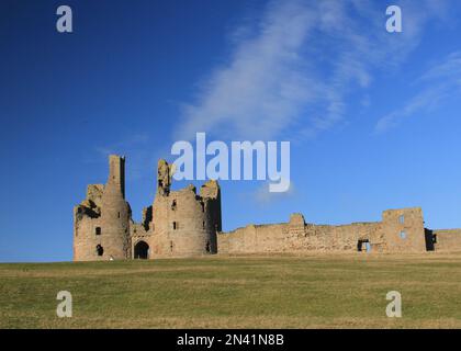 Dunstanburgh Castle in winter sunshine Stock Photo
