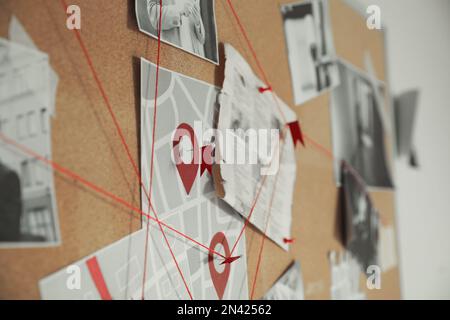 Red String Crime Scene Detective board with crime scene photos, map and clues connected by red ...