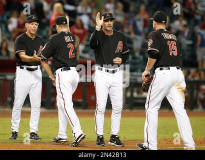 Arizona Diamondbacks bench coach Kirk Gibson leads the way as he instructs  Miguel Montero in base running during spring training baseball drills  Saturday, Feb. 24, 2007 in Tucson, Ariz. (AP Photo/M. Spencer