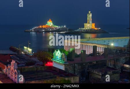 Statue of a saint on an island in the ocean Stock Photo