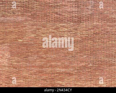Wall with exposed solid ceramic brick aged by time. solid brick large scale texture. Stock Photo