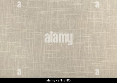 finely textured background of beige linen fabric. Stock Photo