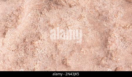 Stone texture close up background of red granite. Stock Photo