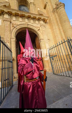 Arahal. Seville. Spain. 14th April, 2022. Penitents of the brotherhood of La Misericordia, from Arahal (Seville), during the processional procession o Stock Photo