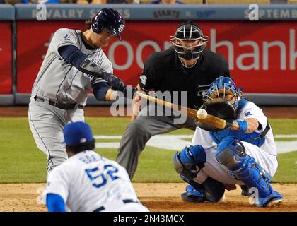 San Diego Padres catcher Pedro Severino puts on catching gear before of a spring  training baseball game against the Cincinnati Reds, Wednesday, March 8,  2023, in Peoria, Ariz. (AP Photo/Abbie Parr Stock