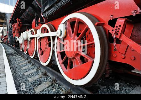 Red wheels of a vintage steam locomotive Stock Photo