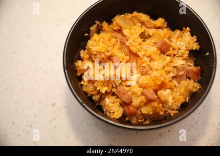 Fried Rice Cooking in pan and bowl Stock Photo