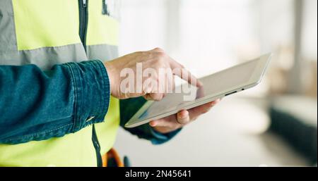 Building, digital tablet and construction worker hands planning and schedule at a site, checking online plan and strategy. Vision, design and engineer Stock Photo
