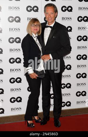 Joan Washington and Richard E. Grant arrive for the GQ Men Of The Year Awards 2014 at a central London venue, London, Tuesday, Sept. 2, 2014. (Photo by Jonathan Short/Invision/AP)