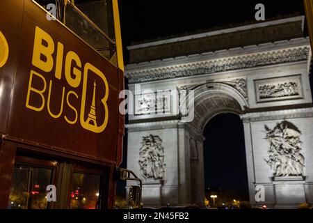 Paris, France - October 26, 2022: Arc de Triomphe and Paris tour bus. Stock Photo