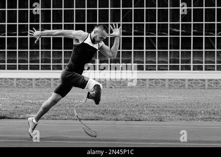 athlete runner disabled run on track black and white photo Stock Photo