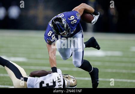 Baltimore Ravens tight end Nathan Overbay (86) takes a Tyrod Taylor pass  for 7 yards before New Orleans Saints linebacker Todd Davis (95) was able  to make the tackle late in the