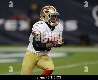 San Francisco 49ers LaMichael James (23) eludes Miami Dolphins