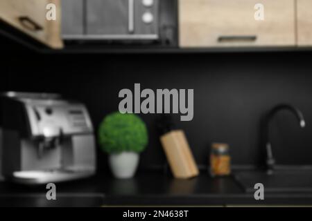 Blurred view of kitchen interior with modern furniture Stock Photo